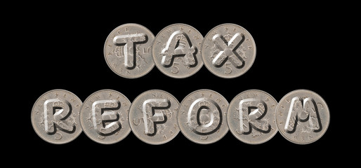 TAX REFORM – Coins on black background