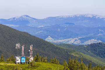 Mobile telecommunication tower or cell tower with antenna and electronic communications equipment in carpathian mountains