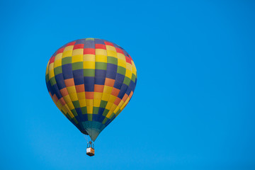 Colorful hot air balloon fly over the blue sky