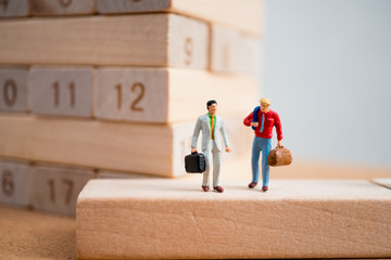 Miniature people, couple businessmen on working site using as business and industrial concept