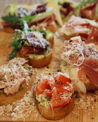 Bruschetta with pesto, tuna, prosciutto