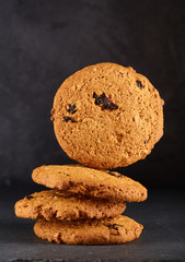 Chocolate chips cookies isolated on black background, macro, close-up