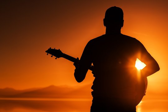 Guitar Playing at Sunset