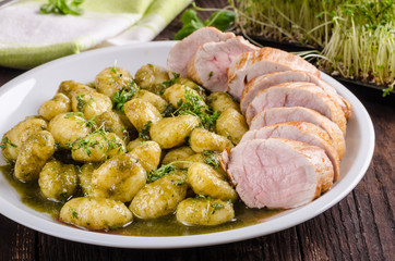 Pork tenderloin with herbs and spices, pesto gnocchi