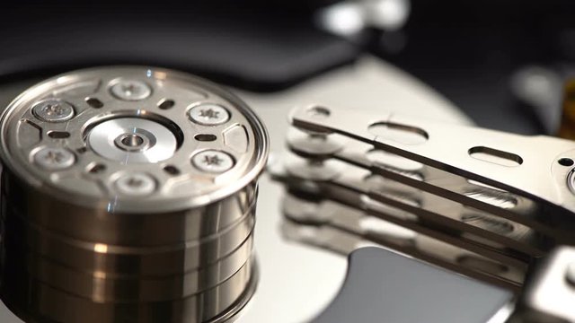 Closeup internals of SATA hard disk drive, shallow depth of field, sliding video