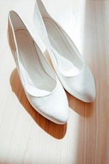 Pair of white high heels