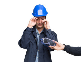 Worker suffering for an eyes irritation. Isolated on white