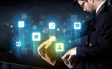 Modern smart table with high tech icons on its interface screen
