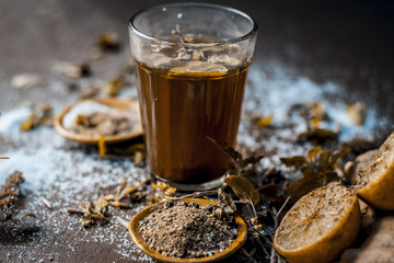 Ayurvedic/Herbal drink i.e Kashmiri Kahwa drunk in winter season in asia and India with all its ingredients in dark Gothic colors.