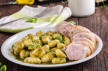 Pork tenderloin with herbs and spices, pesto gnocchi