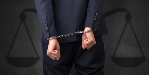 Arrested man with balance on the background
