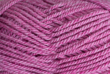 a skein of pink wool yarn