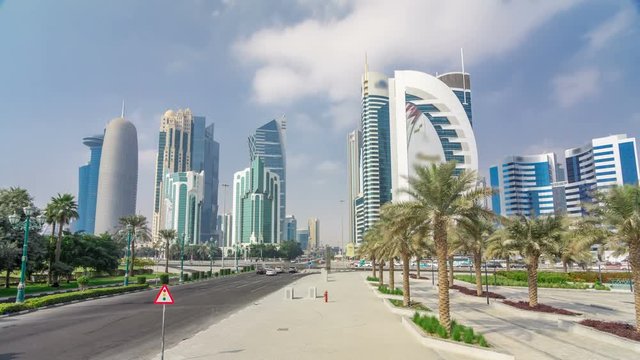 The high-rise district of Doha with traffic on intersection timelapse hyperlapse