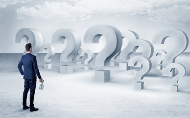 Man with  lot of question mark signs and icons
