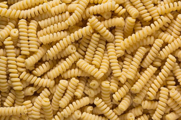 pasta spirals in the form of a background