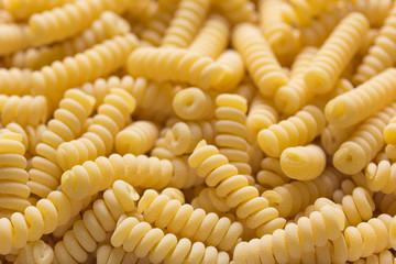 pasta spirals in the form of a background