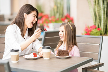 Hispanic mother and daughter on a date at restaurant