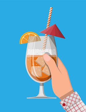 Glass of cold drink, alcohol cocktail in hand.