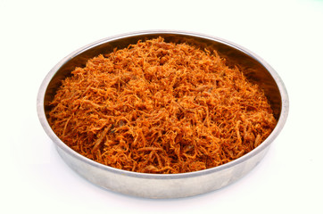 Dried shredded pork in the aluminum tray on white background