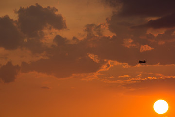 The sunset sky with airplane