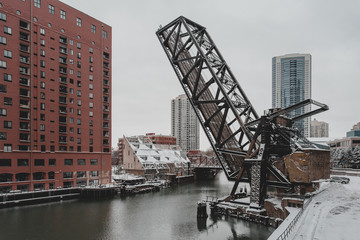 Raised bridge surrounded by towers in urban area