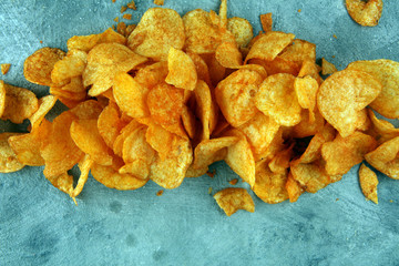 Crispy potato chips. Paprika chips on table. Spicy crunchy chips