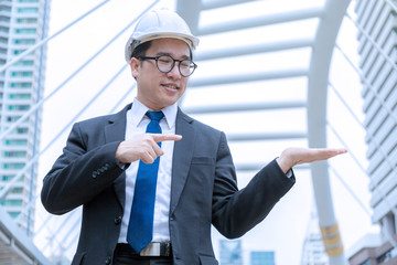 Engineer present product on his hand.