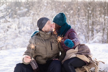 Fototapeta na wymiar Romantic kiss with bengals at winter outdoors