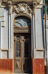 Old beautiful vintage wooden door of noble mansion
