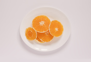 Sliced orange on a whiite plate