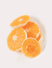 Sliced orange on a whiite plate