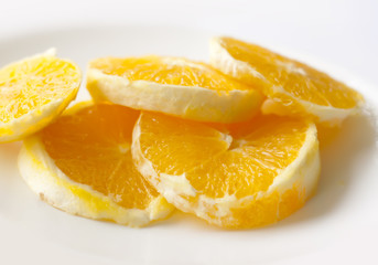 Sliced orange on a whiite plate