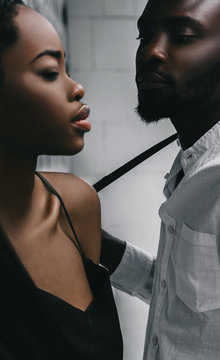 Modern black man and caucasian woman in a town.
