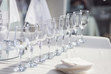 empty glasses for champagne on a buffet table