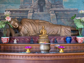 Statue of the Buddha god in the Buddhist temple Brahma Vihara Arama with statues of the gods on...
