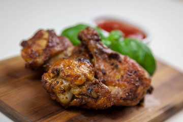 Chicken wings with sweet chilli sauce on the white background