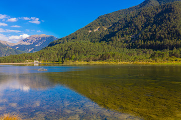 Fototapeta premium Beautiful lake between mountains with reflections in the water