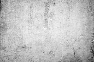 Fototapeta premium Weathered and dirty concrete wall texture background in black and white with vignetting