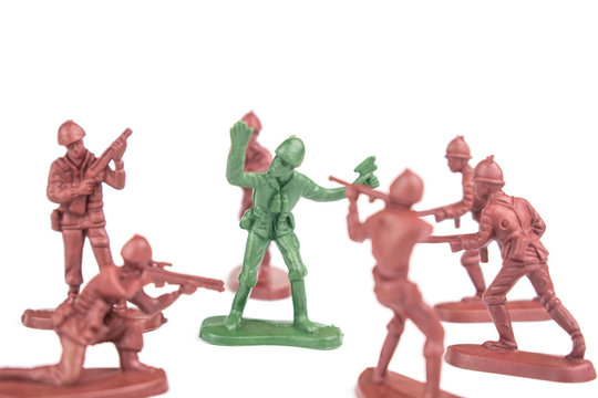 Figures of soldiers with weapons in battle on a white background. Isolated.