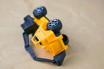 Construction machinery. Inverted toy excavator.