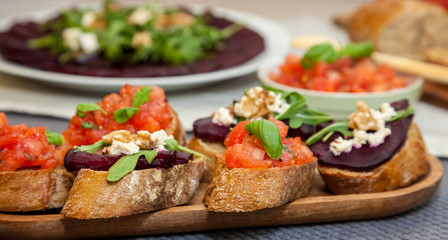 Bruschetta and sandwich with beetroot, beet carpaccio on the background - healthy food