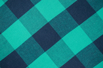 Background of tissue in a green cage.