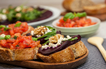 Bruschetta and sandwich with beetroot, beet carpaccio on the background - healthy food