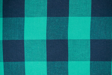 Background of tissue in a green cage.