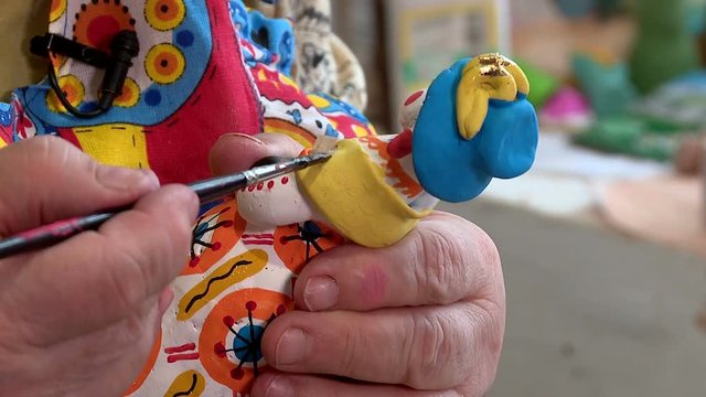 painted clay Dymkovo toys with paints and gold leaf