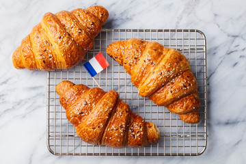 Croissants with baking ingredients. Traditional French pastry. Top view