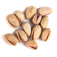 Heap of salted pistachio nuts isolated on a white background