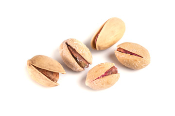 Heap of salted pistachio nuts isolated on a white background