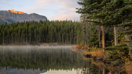 Fototapeta premium Autumn Sunrise reflection at Herbert Lake in Banff National Park