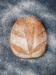 Fresh bread on table. Homemade bread. Kitchen or bakery poster design. Bread background